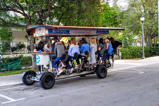 Pedibus Pub Crawl in Fort Lauderdale - The ride setup: music, cup, photo, and a guide at the wheel